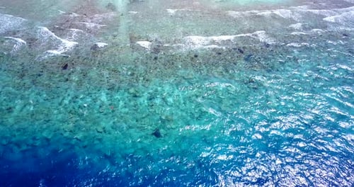 Natural overhead tourism shot of a summer white paradise sand beach and turquoise sea background in