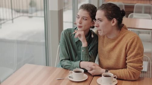 Man and Woman Having Talk in Cafe