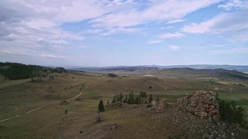 Baikal Valley spirits,Tazheran Steppe, Stone Cliffs on the Road. Aerial Summer