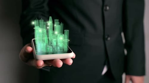 Geschäftsmann hält 3D-Stadtmodell in der Hand, das Augmented-Reality-Technologie zeigt
