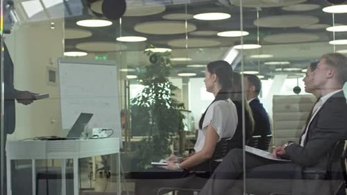 Business Meeting Presentation in Modern Office