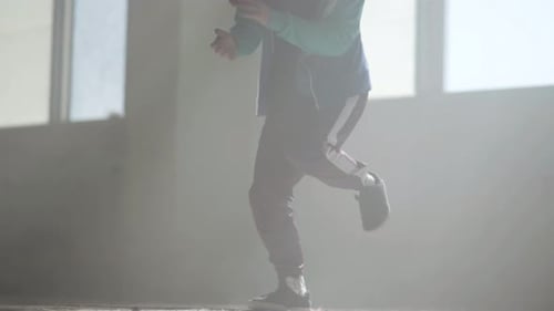 Young Rapper Dancing in an Abandoned Building