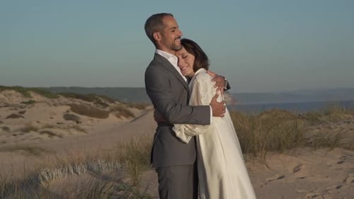 Romantic Couple Embracing on a Sandy Beach