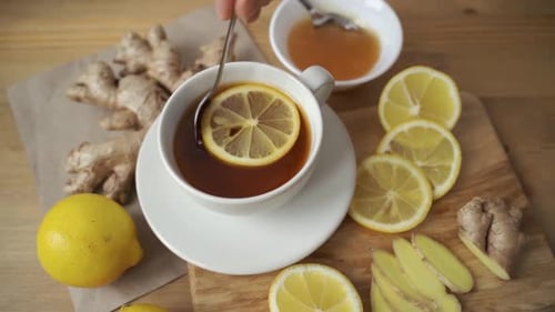 Preparing Ginger and Lemon Tea Drink with Honey