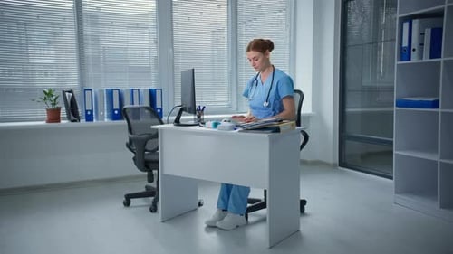 Unhappy Stressed Female Doctor Feeling Pressure and Strong Headache Pain Sitting in Hospital Upset