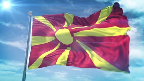 Realistic Flag Of North Macedonia Waving Under Blue Sky