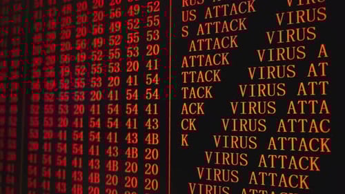 Texto rojo del programa ATAQUE DE VIRUS en la pantalla del PC