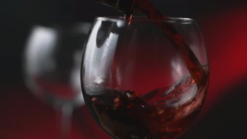 Red Wine being Poured Into Glass Close Up
