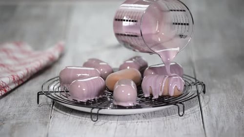 Mousse Cakes Getting Purple Glaze Coating