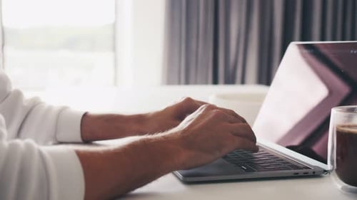 Close Up Shot of Hands of Unrecognizable Businessman Typing on Laptop Keyboard While Working at Home
