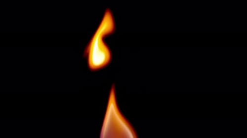 Single flame burning against dark background