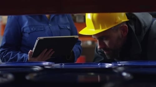 Warehouse Workers Checking Inventory