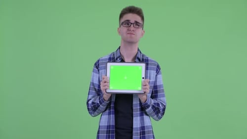 Young Adult Holding Tablet on Green Screen