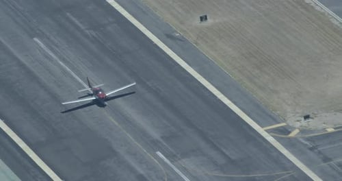 Aerial Shot of Small Airplane on Runway