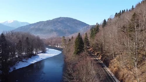 View of the beautiful snow-capped mountains on a winter day. Drone camera.