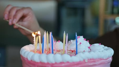Lighting Birthday Candles on a Festive Cake