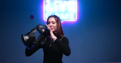 Young Woman Puts VR Glasses Game
