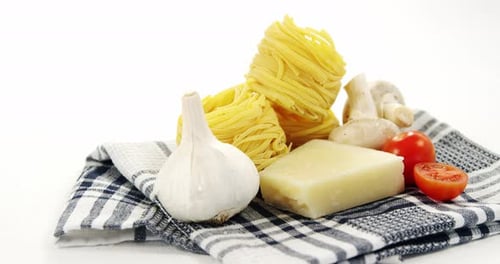 Raw spaghetti with ingredients