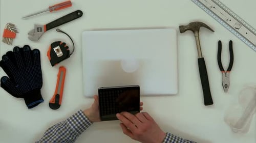 Architect Male Hands Using Digital Tablet in the Office