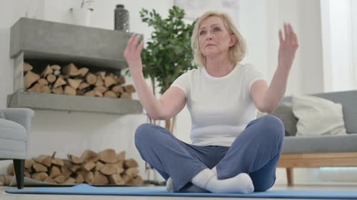Close Up of Senior Old Woman Doing Meditation with Eyes Closed