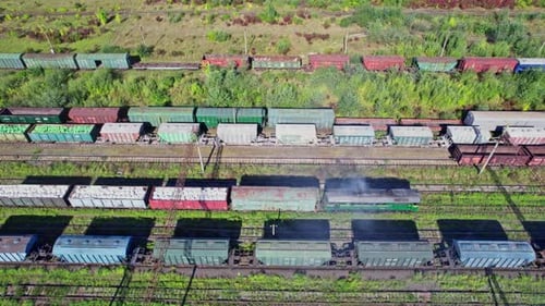 Freight Train Cars on Railroad Tracks From Above