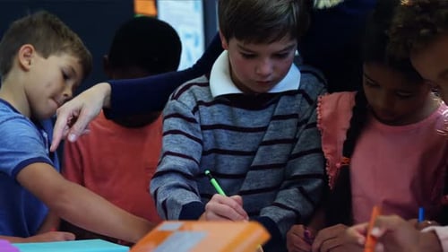 Children Drawing Together in Elementary School Classroom