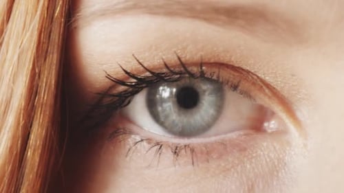 Beautiful Woman's Blue Eye Blinking Close Up
