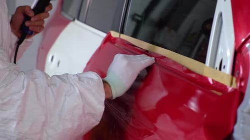 Applying Red Car Vinyl Wrap Using Heat Gun