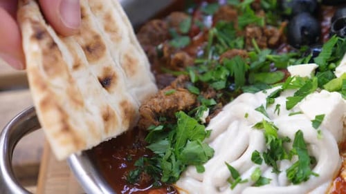 Meat and Cheese Dish with Flatbread Close Up