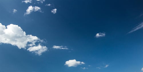 Clouds Floating Slowly Across Blue Sky