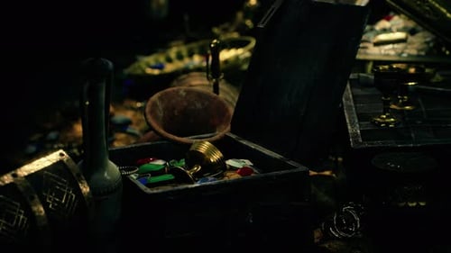 Treasures in a Dark Cave with Coins Diamonds and Gold