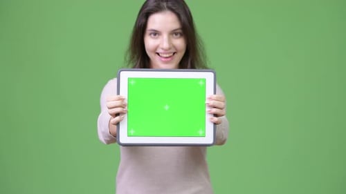 Smiling Woman Holding Tablet with Chroma Key Screen