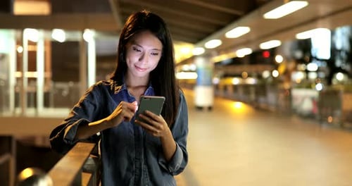 Young woman use of smart phone in city