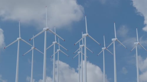 Windmill farm in sunny weather. Renewable energy concept. Eco power.