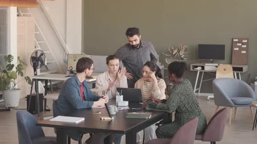 Team of Coworkers Brainstorming Ideas in Office