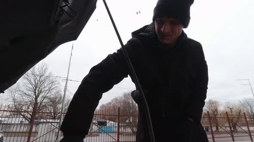 The Man Opens The Hood Of The Car