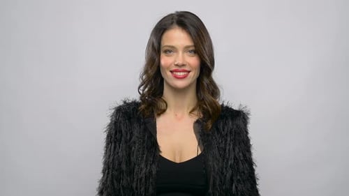 Young Adult Female Presents Gift Indoors