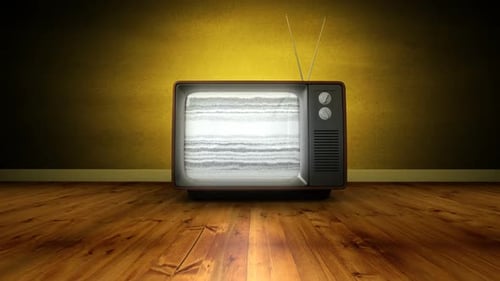 Zoom in of old TV turning on and no signal