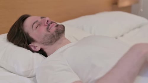 Casual Young Man Going to Bed and Sleeping