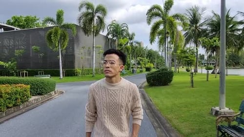 Portrait of man walking at park