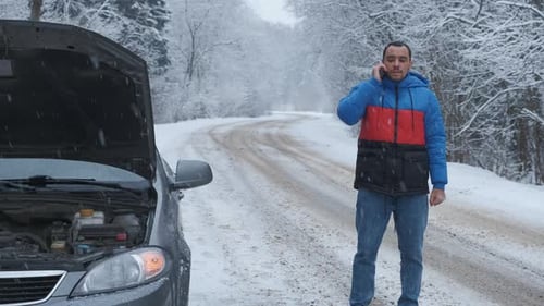 Man Calling for Help in Snowy Forest Road