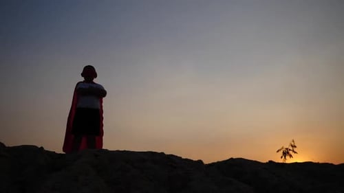 superhero boy running on the field