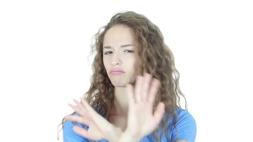 Young Woman Gesturing Stop With Her Hands