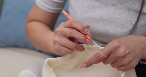 Woman Crocheting Cream Yarn, Close Up Detail