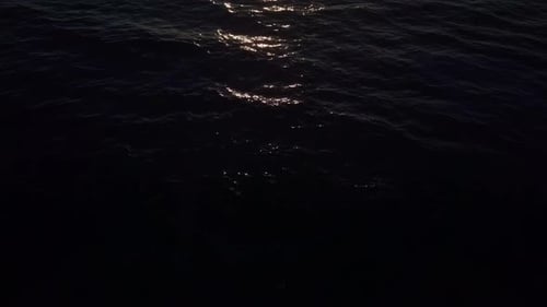 Aerial View Drone Flying Over Sea Surface in Evening Sun Light, Golden Hour Sunset, Cinematic Shot