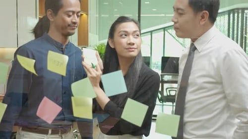 Creative Team Brainstorming Ideas Together in Office