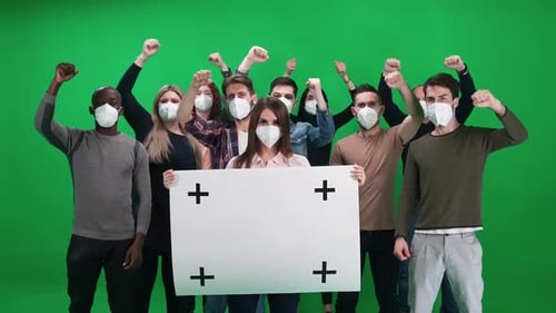 Group with Sign Wearing Masks on Green Screen