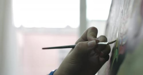 Drawing Process in the Art Studio of the Artist's Hand Art Girl with a Brush Painting on Canvas