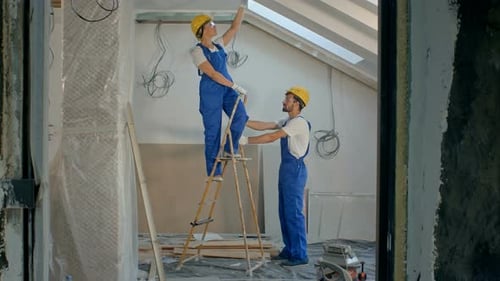 Team Renovating Interior Painting Home