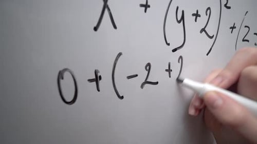Student Writing Math Equation on Whiteboard Doing Mathematics Exercises